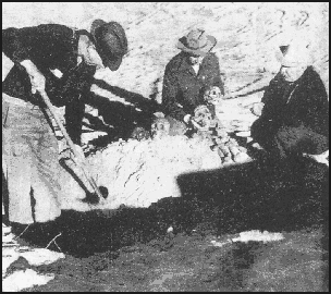 Picture of Barry holding skeletal heads